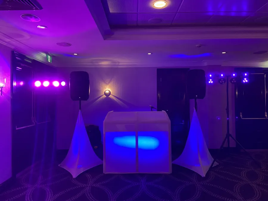 Wedding DJ Hire: DJ setup with blue lighting