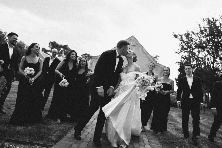 Rogue Weddings: the bridal party walking together in black and white