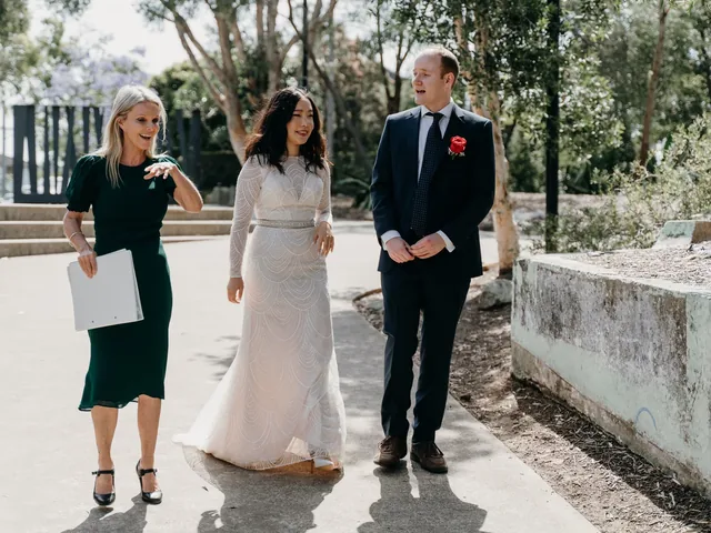 Lovesick Weddings: Couple and celebrant after an outdoor Sydney ceremony