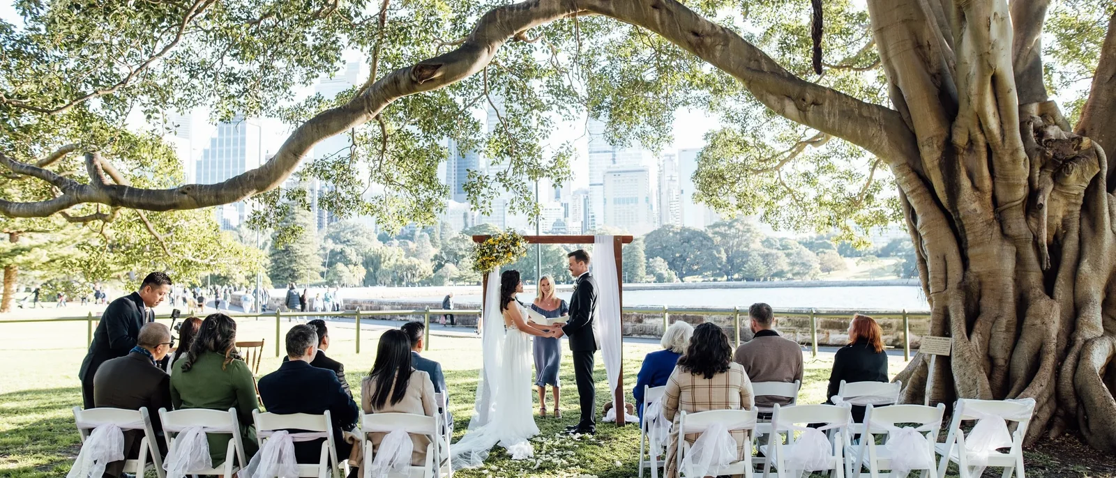Wedding ceremony styled by Lovesick Weddings under a fig tree by Sydney Harbour