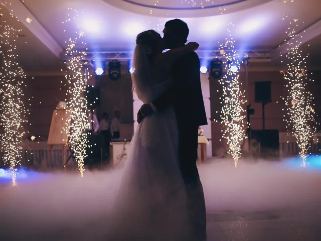 Sydney DJ & MC Services: Silhouetted first dance framed by cold sparklers and fog