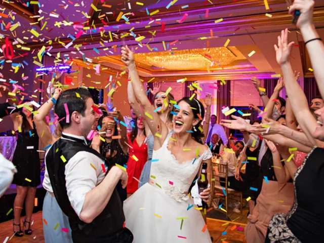 Sydney DJ & MC Services: Bride and groom dancing under confetti from the confetti machine