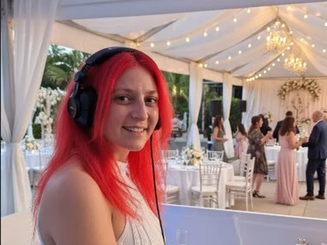 Sydney DJ & MC Services: DJ Ange at the decks at a marquee wedding