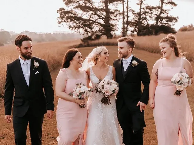 Bridal party walking through the paddocks at The Conservatory